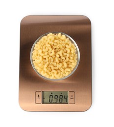 Photo of Electronic kitchen scale with bowl of raw pasta isolated on white, top view