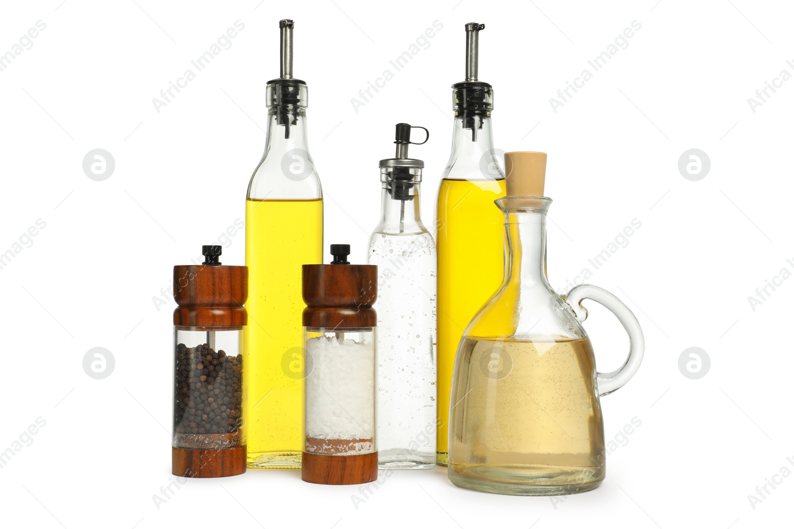 Photo of Salad dressings and spices isolated on white