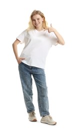 Photo of Young woman wearing blank t-shirt on white background. Mockup for design