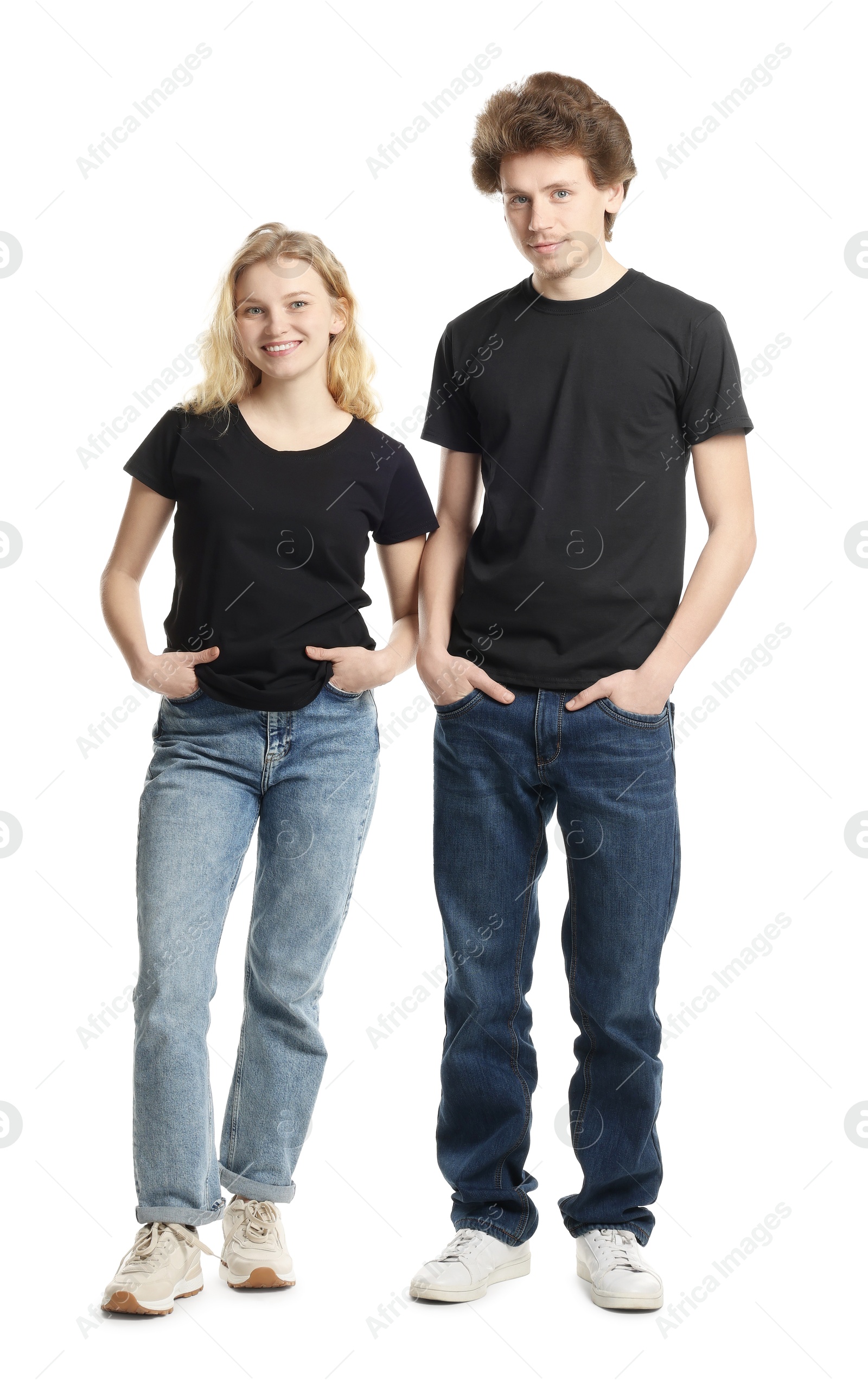 Photo of Young woman and man wearing blank black t-shirts on white background. Mockup for design