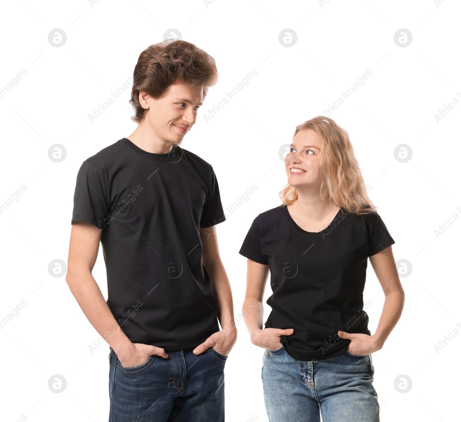 Photo of Young woman and man wearing blank black t-shirts on white background. Mockup for design