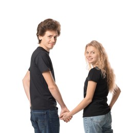 Photo of Young woman and man wearing blank black t-shirts on white background. Mockup for design