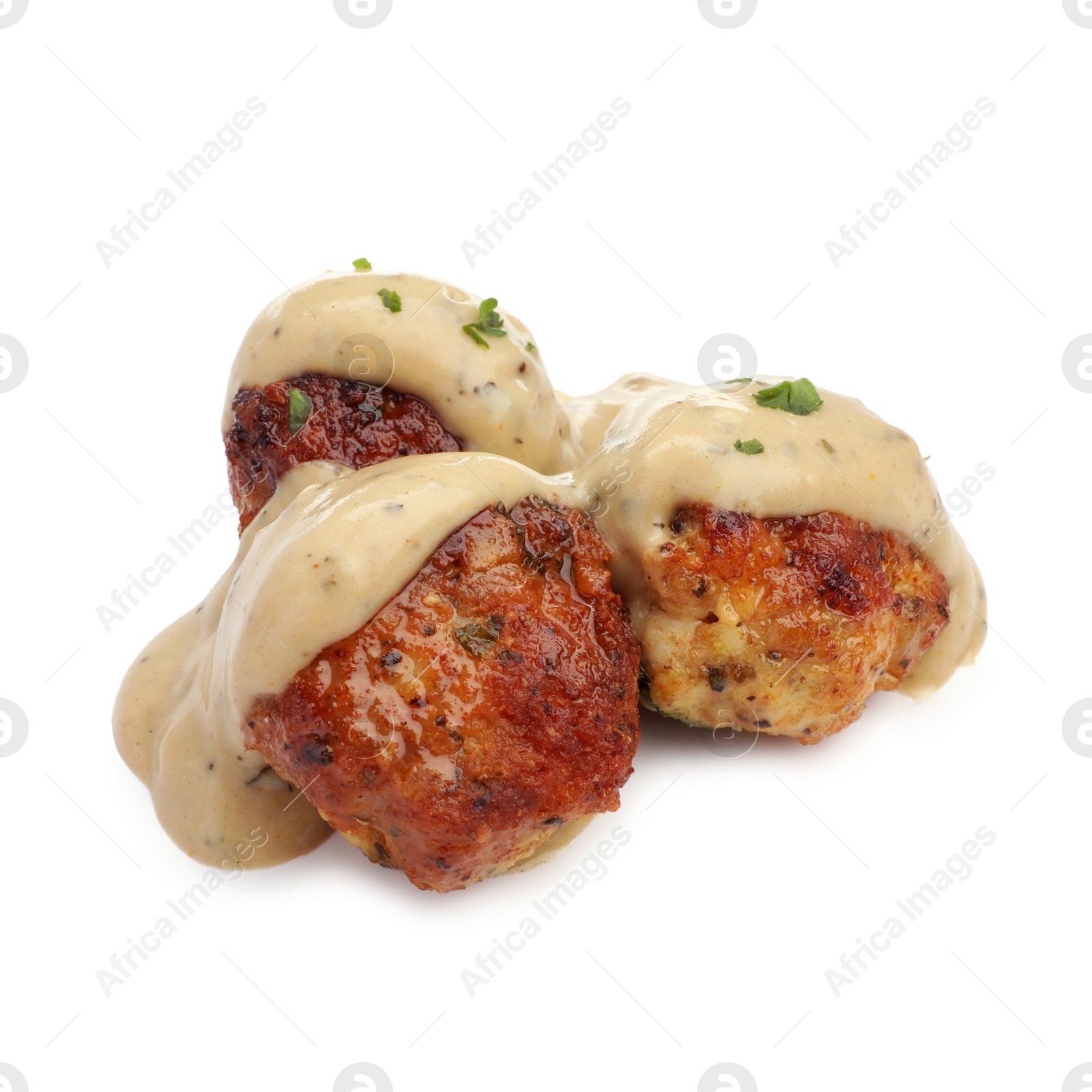 Photo of Delicious meatballs with creamy sauce isolated on white