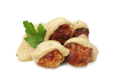 Photo of Delicious meatballs with creamy sauce isolated on white