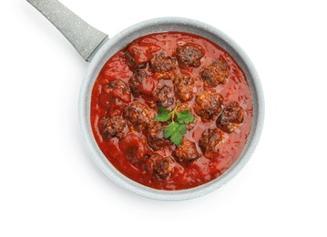 Photo of Delicious meatballs with tomato sauce in frying pan isolated on white, top view