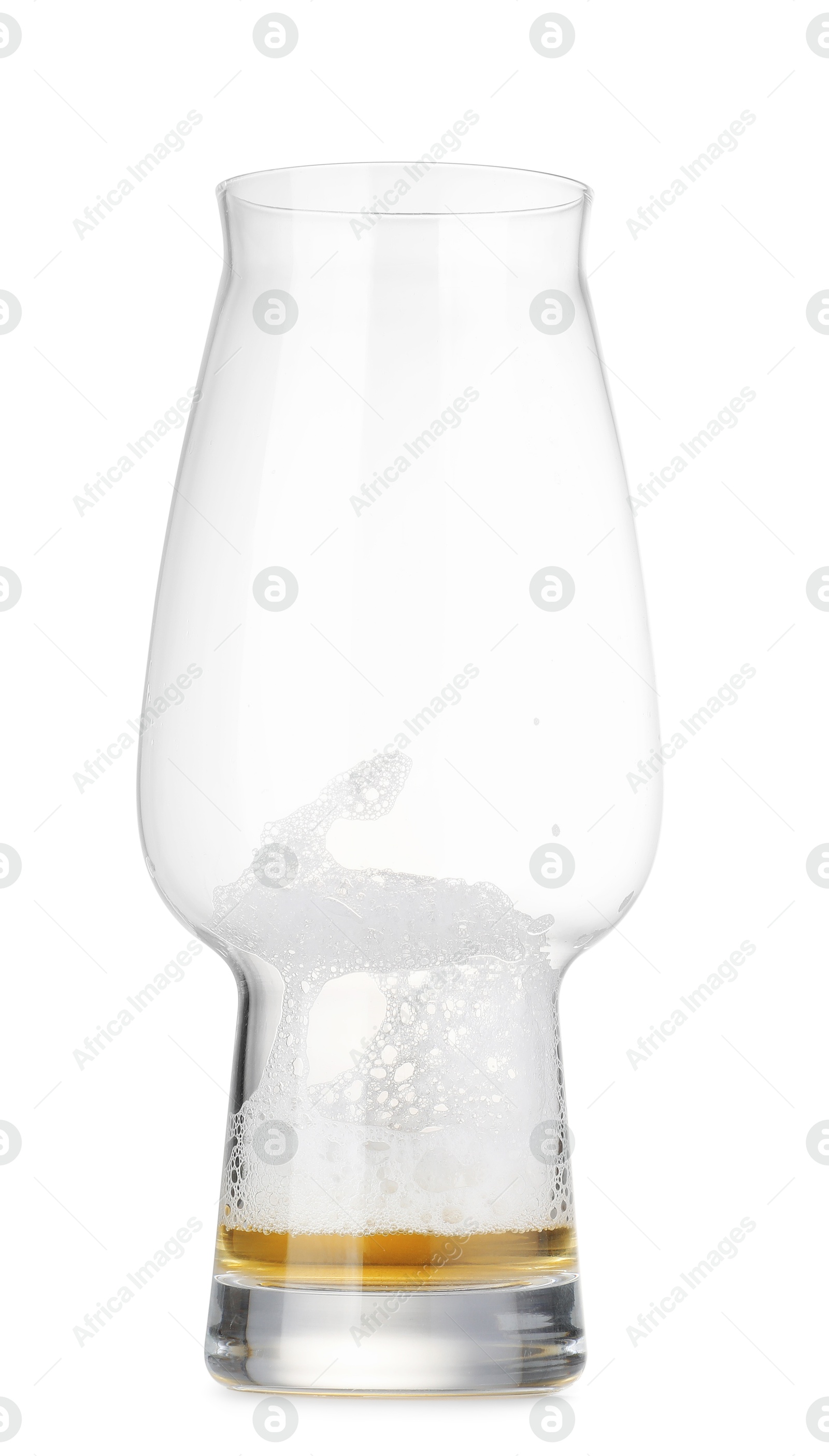 Photo of Almost empty glass of beer isolated on white