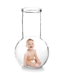 Cute baby in glass flask on white background. In vitro fertilisation