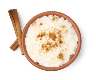 Photo of Tasty rice pudding with cinnamon isolated on white, top view