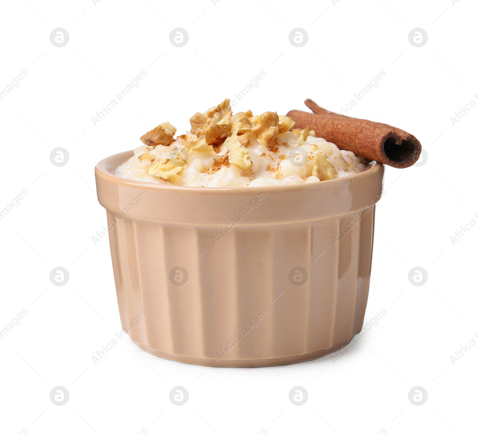 Photo of Tasty rice pudding with walnuts and cinnamon isolated on white