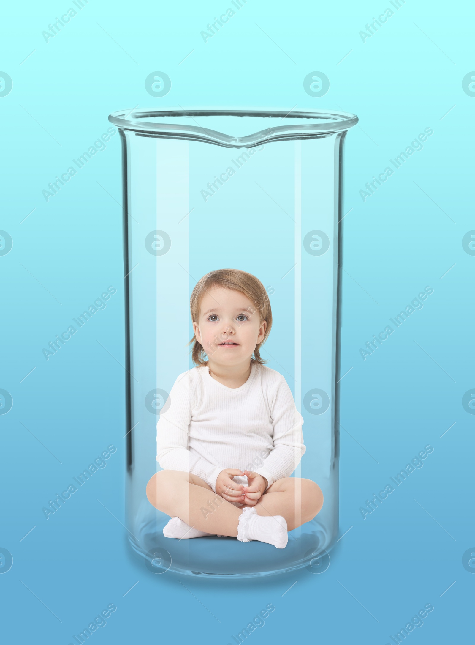 Image of Cute baby in glass beaker on light blue gradient background. In vitro fertilisation