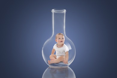 Cute baby in glass flask on dark blue gradient background. In vitro fertilisation