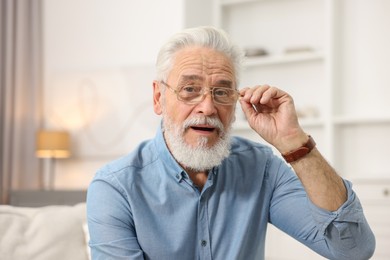 Photo of Portrait of handsome bearded man at home