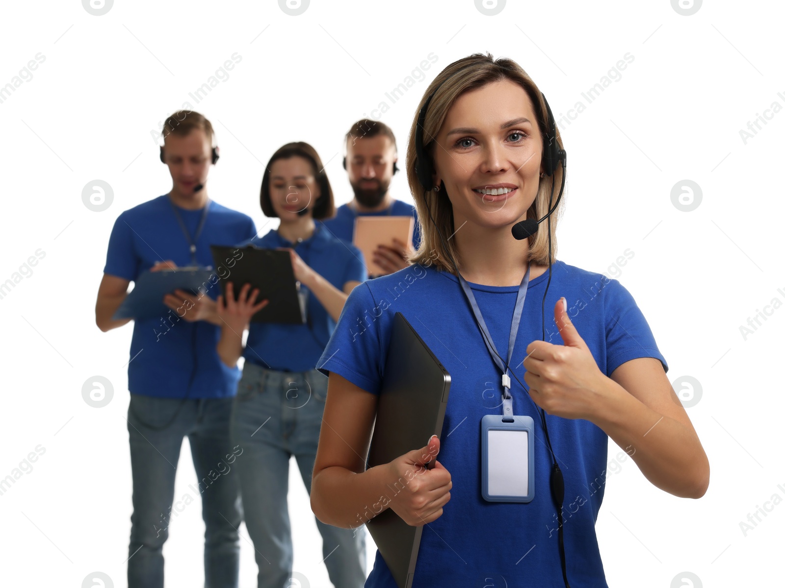 Photo of Technical support call center. Team of friendly operators on white background