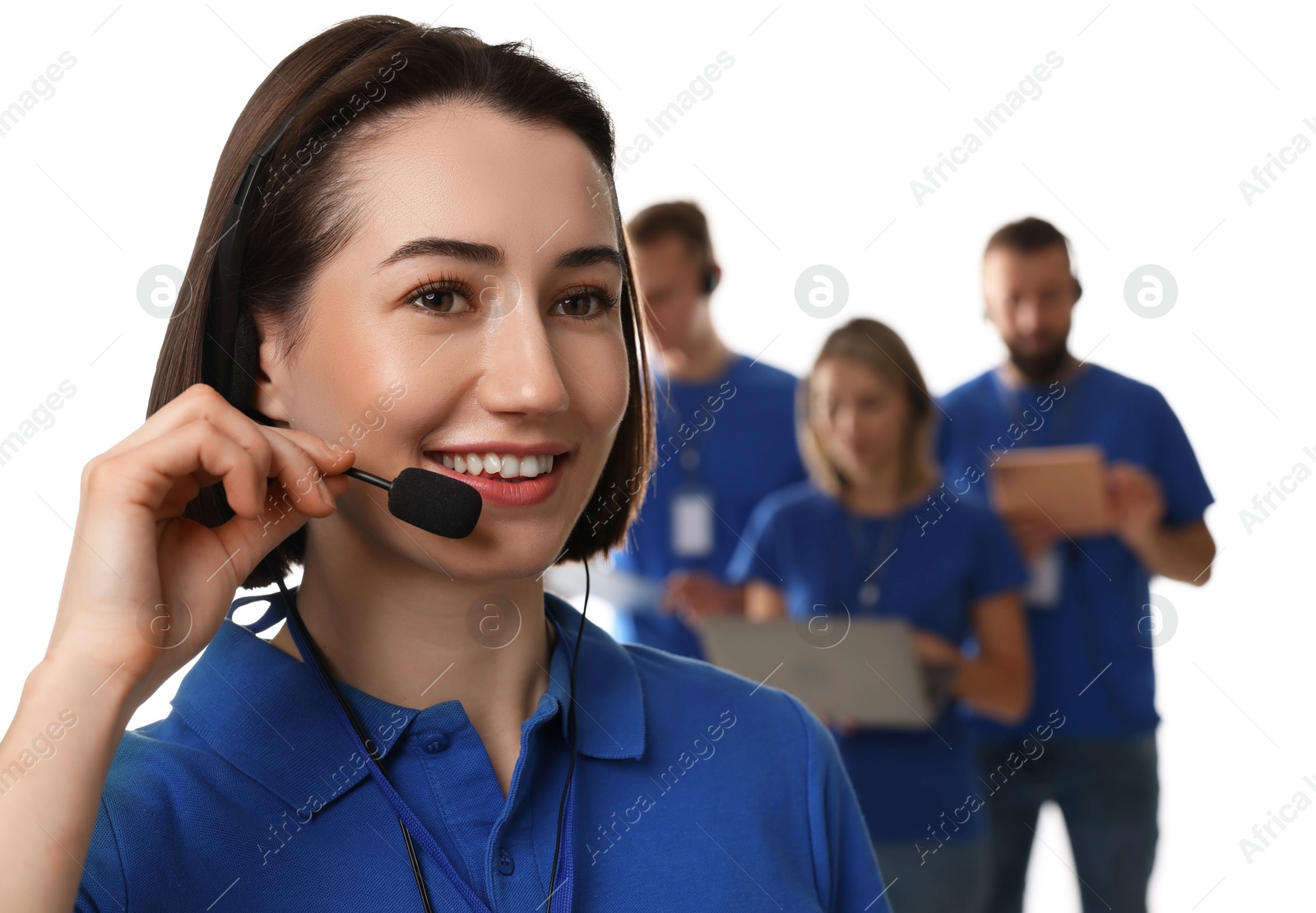 Photo of Technical support call center. Smiling operator on white background, selective focus