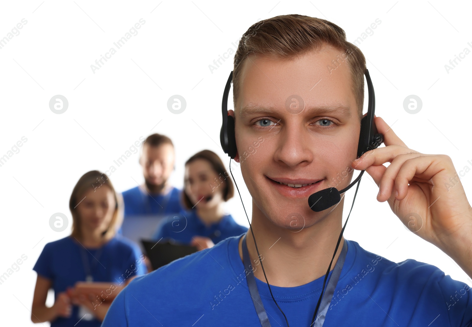 Photo of Technical support call center. Smiling operator on white background, selective focus