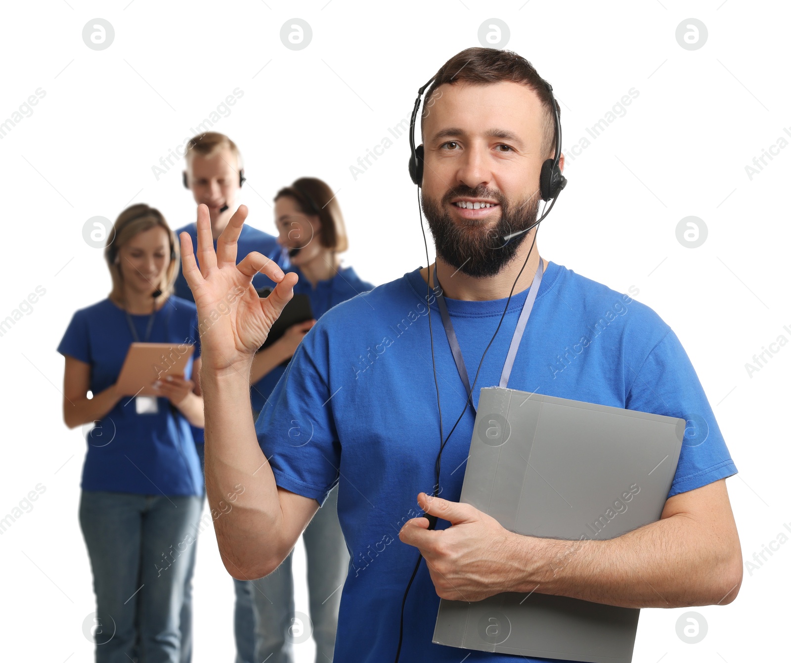 Photo of Technical support call center. Team of friendly operators on white background