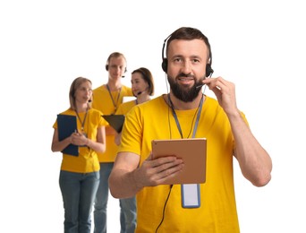 Photo of Technical support call center. Team of friendly operators on white background