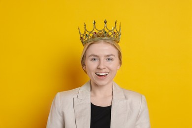 Photo of Happy businesswoman in elegant crown on yellow background