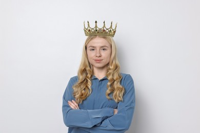 Photo of Woman in elegant crown on light background