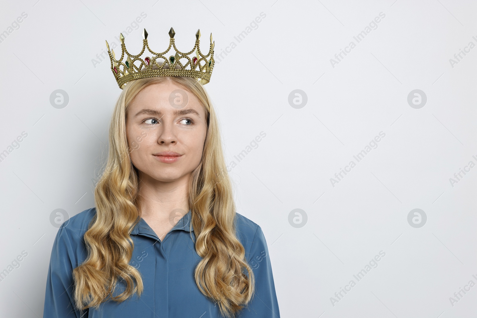 Photo of Woman in elegant crown on light background. Space for text