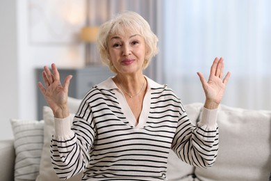 Portrait of grandmother with beautiful makeup at home