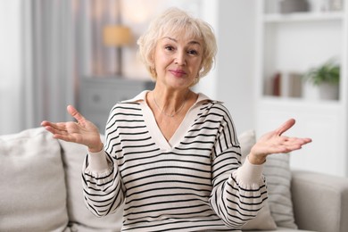 Photo of Portrait of grandmother with beautiful makeup at home