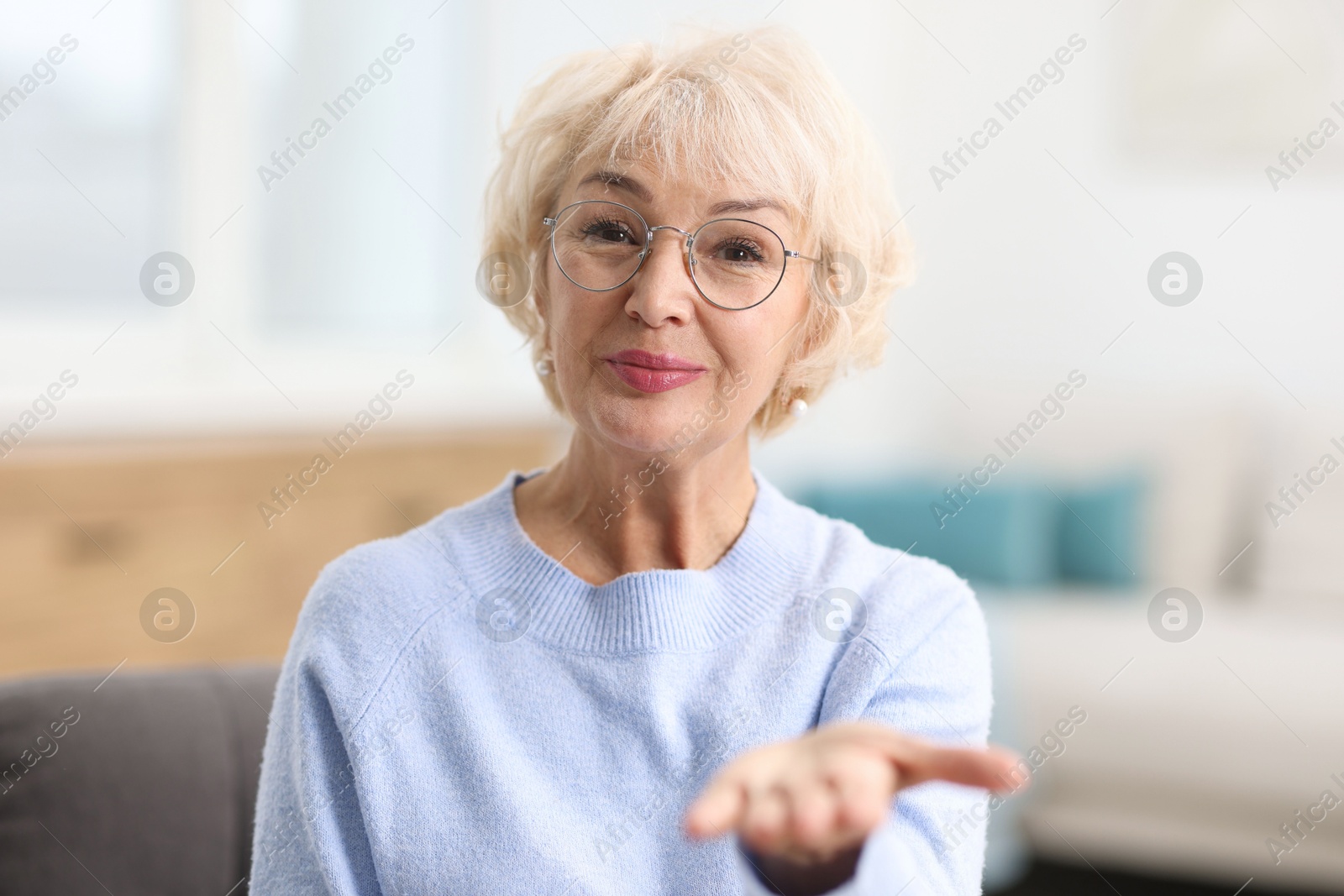 Photo of Portrait of grandmother with beautiful makeup at home