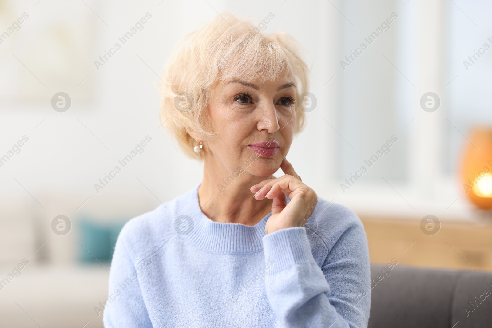 Photo of Portrait of grandmother with beautiful makeup at home