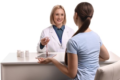 Photo of Weight loss. Smiling nutritionist consulting patient at table against white background