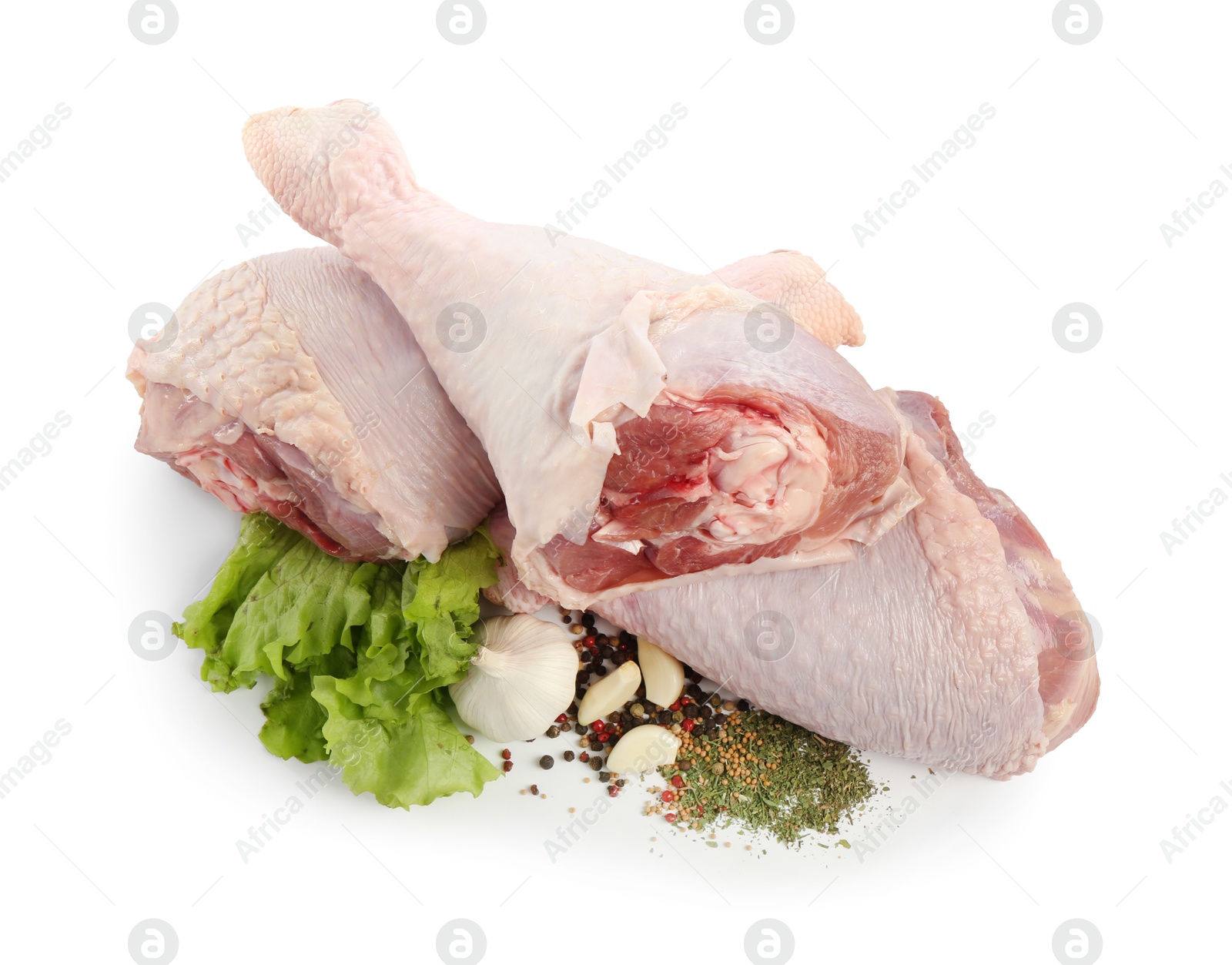 Photo of Raw turkey drumsticks and spices isolated on white, top view