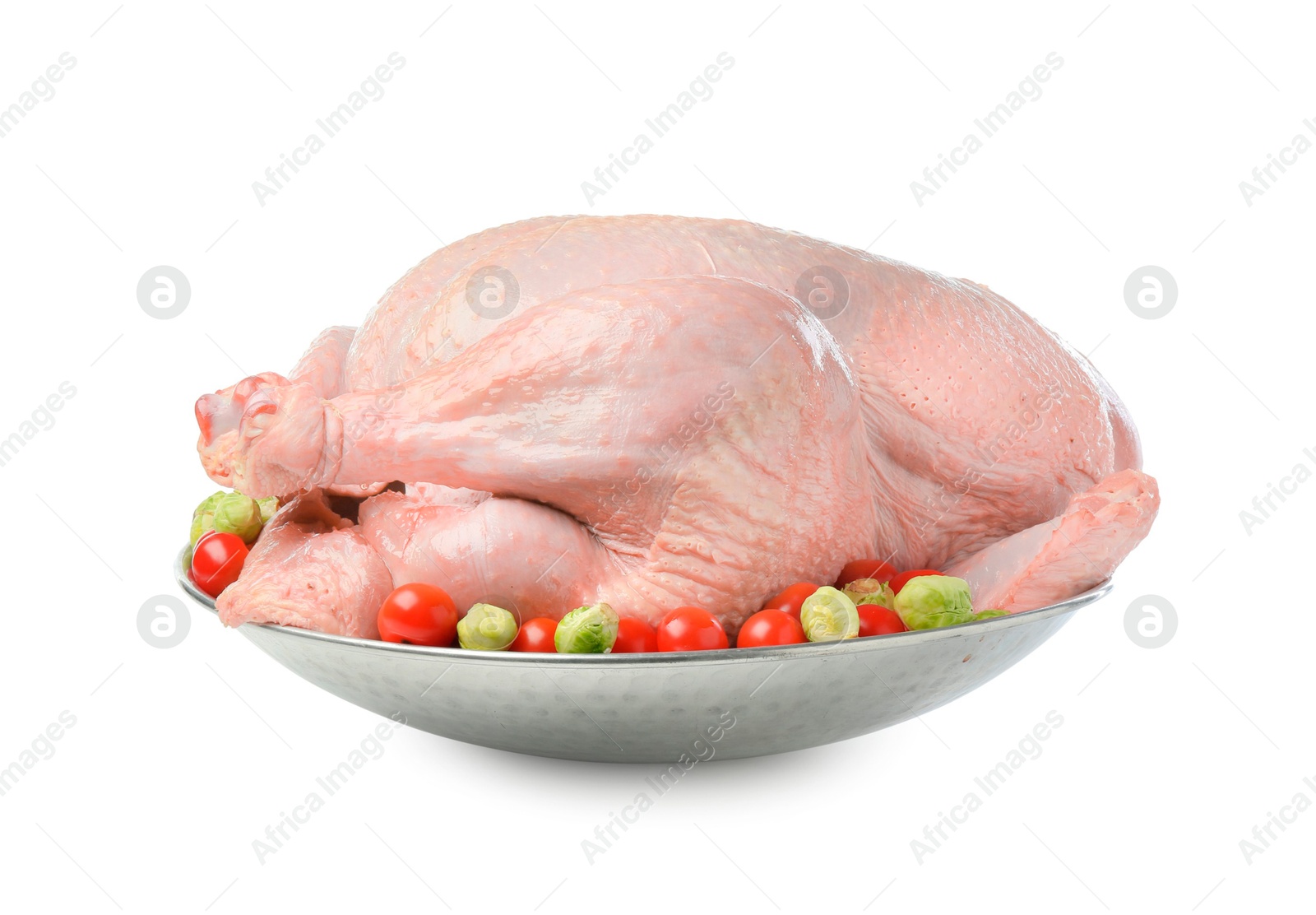 Photo of Whole raw turkey with vegetables isolated on white