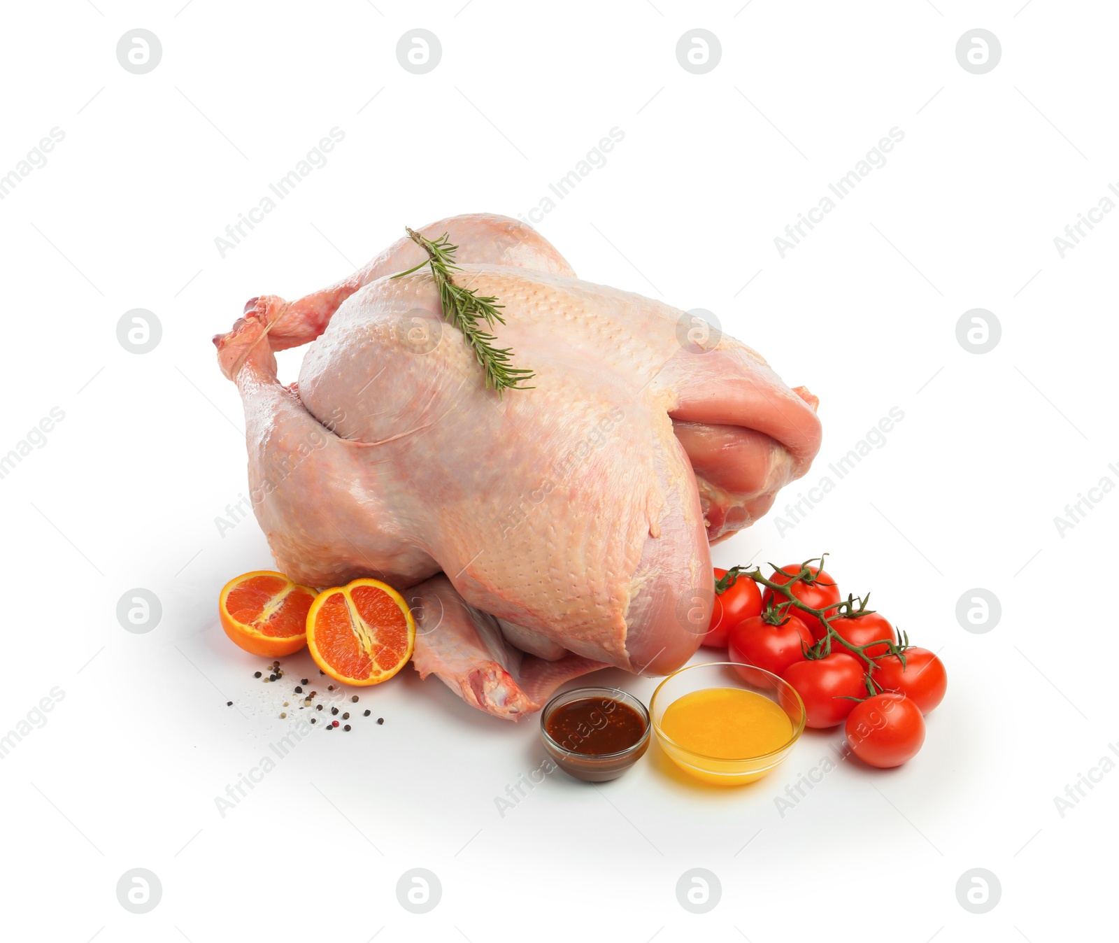 Photo of Whole raw turkey with ingredients isolated on white