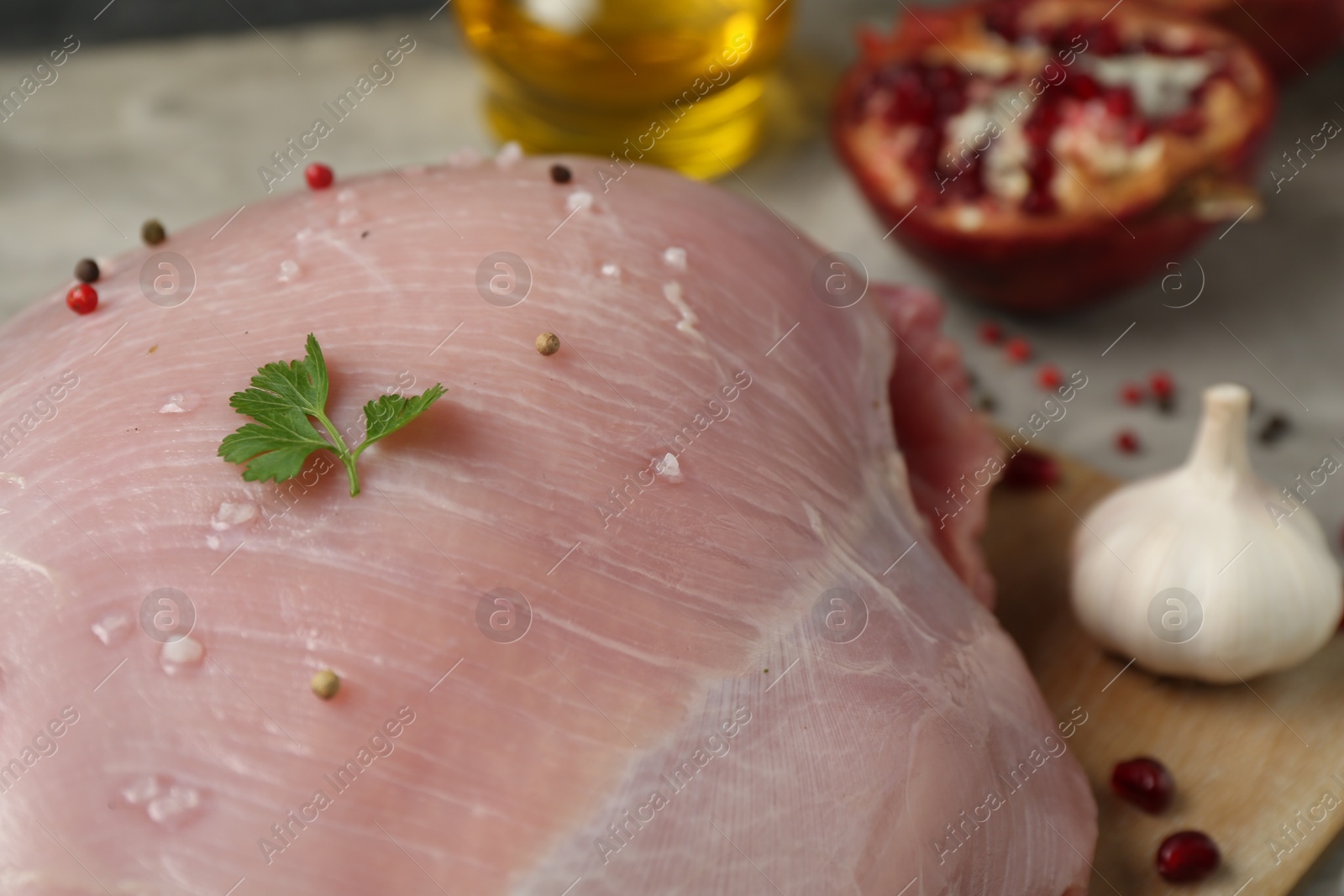 Photo of Raw turkey breast and ingredients on table, closeup