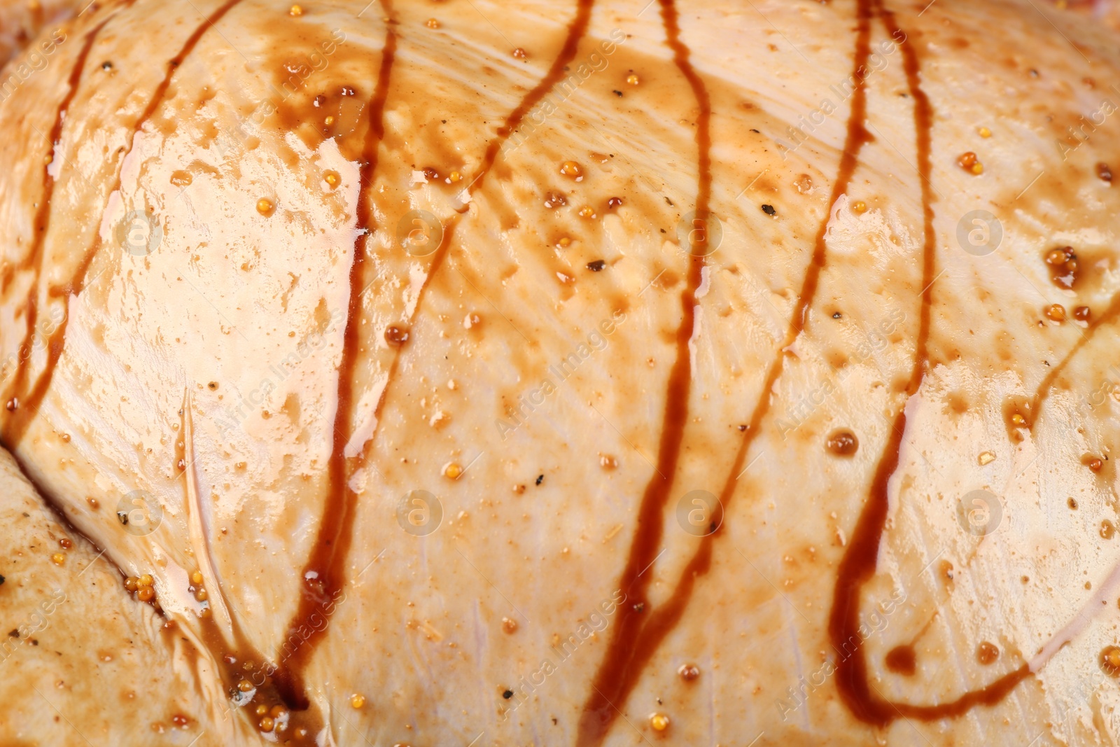 Photo of Raw marinated turkey meat as background, closeup