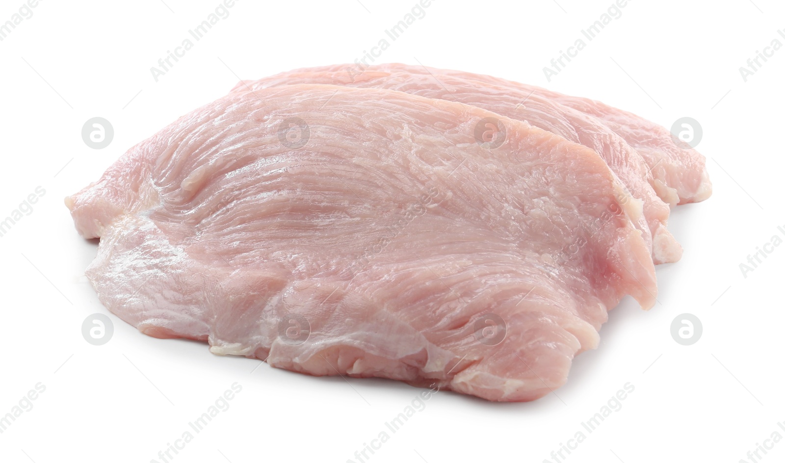 Photo of Pieces of raw turkey meat isolated on white