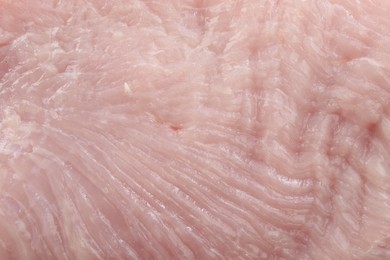 Raw turkey meat as background, closeup view