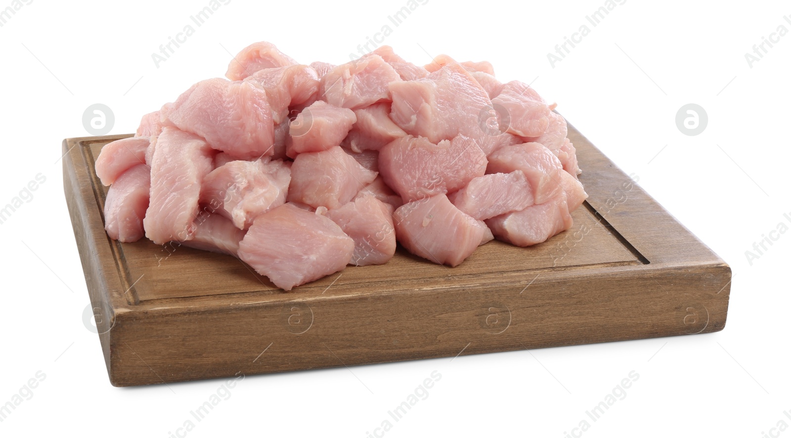 Photo of Wooden board with pieces of raw turkey meat isolated on white