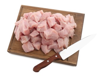 Photo of Wooden board with pieces of raw turkey meat and knife isolated on white