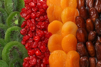 Photo of Different dried fruits as background, top view