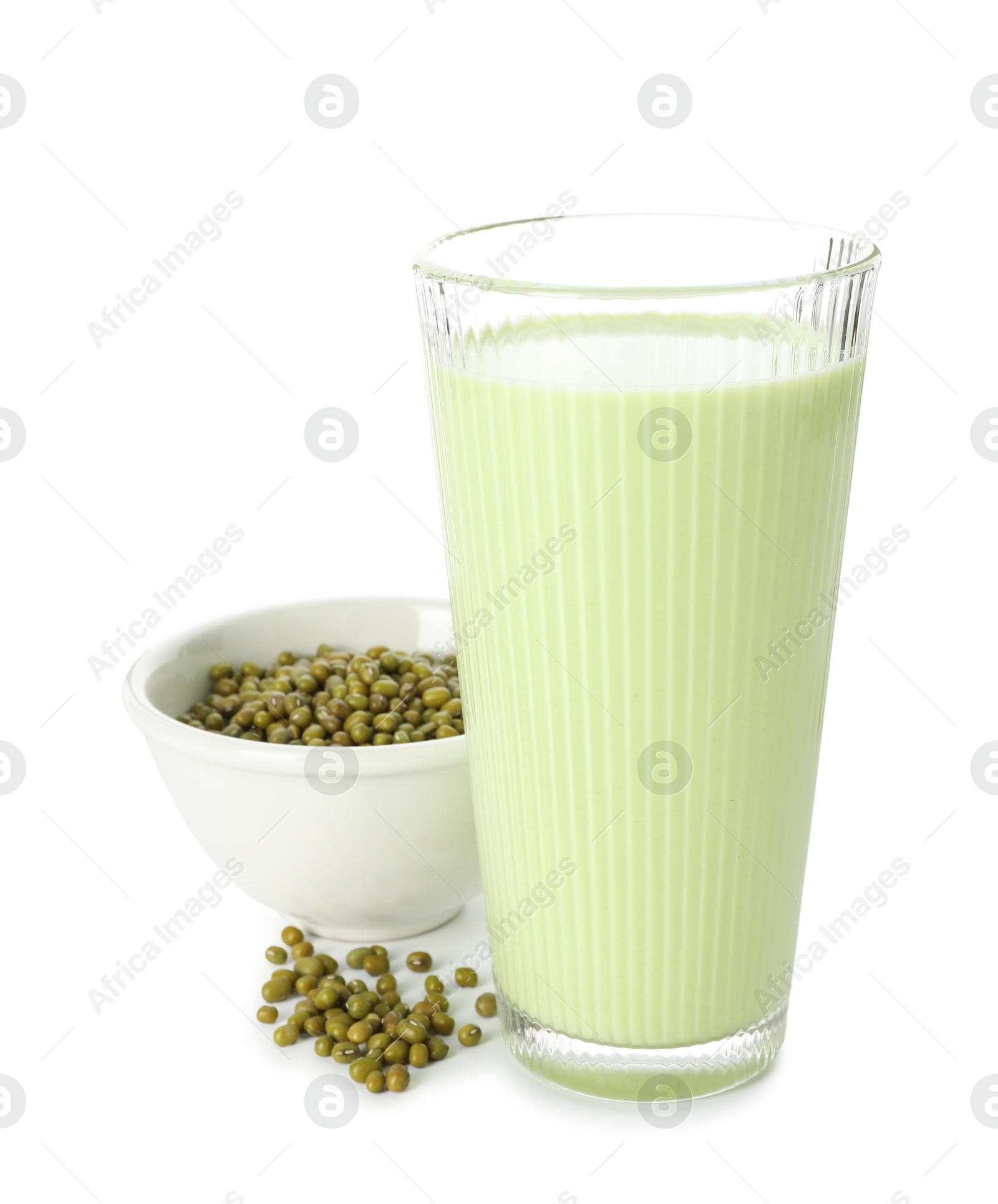 Fresh mung bean juice in glass and seeds isolated on white Photo of Fresh mung bean juice in glass and seeds isolated on white