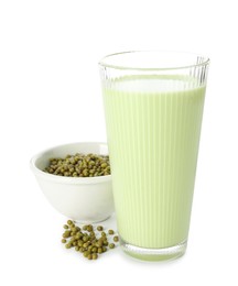 Photo of Fresh mung bean juice in glass and seeds isolated on white