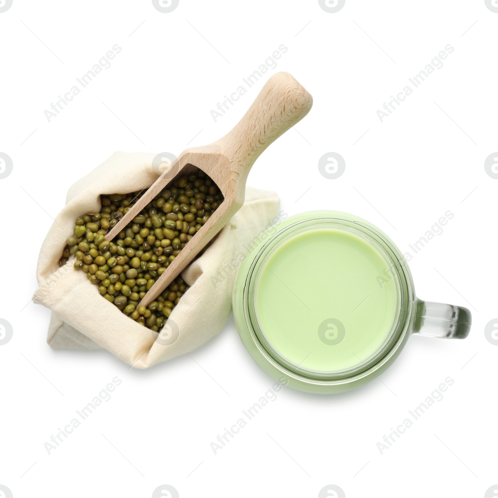 Fresh mung bean juice in mason jar, scoop and seeds isolated on white, top view Photo of Fresh mung bean juice in mason jar, scoop and seeds isolated on white, top view