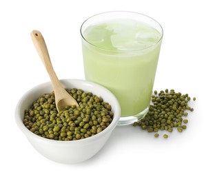 Photo of Fresh mung bean juice in glass and seeds isolated on white