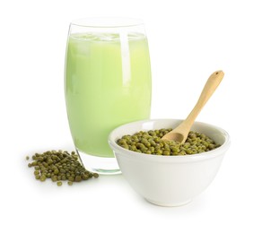 Photo of Fresh mung bean juice in glass and seeds isolated on white