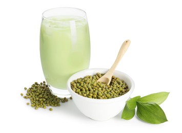 Photo of Fresh mung bean juice in glass, seeds and green leaves isolated on white