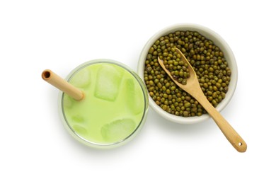 Photo of Fresh mung bean juice in glass and seeds isolated on white, top view