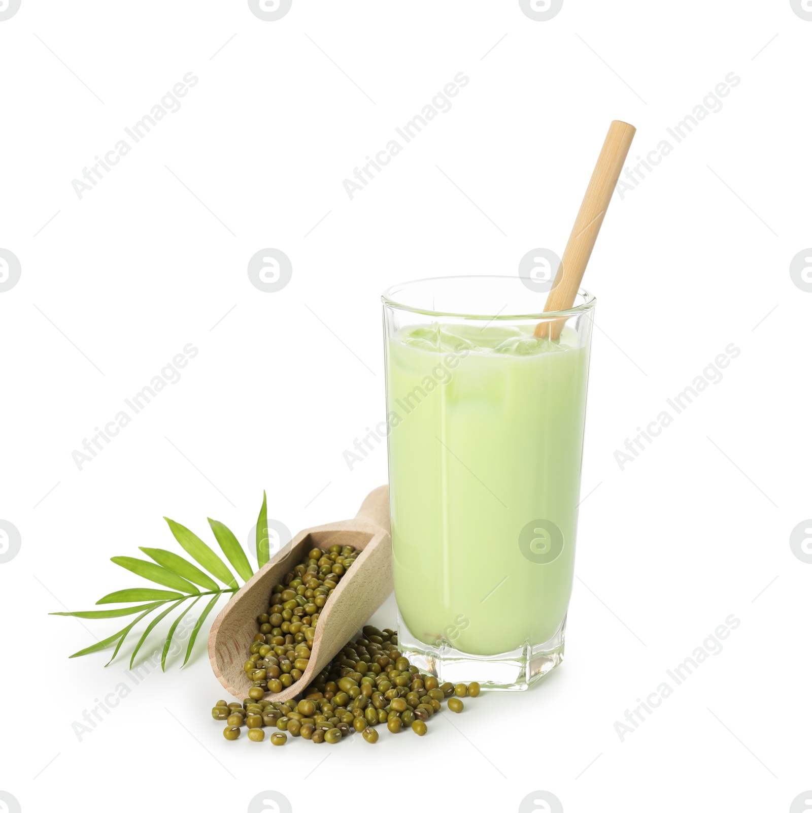 Fresh mung bean juice in glass, seeds, scoop and green twig isolated on white Photo of Fresh mung bean juice in glass, seeds, scoop and green twig isolated on white