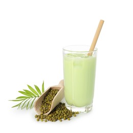 Photo of Fresh mung bean juice in glass, seeds, scoop and green twig isolated on white