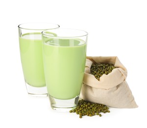 Photo of Fresh mung bean juice in glasses and seeds isolated on white