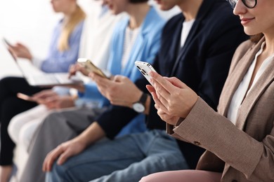 Group of people using different gadgets indoors, closeup. Modern technology